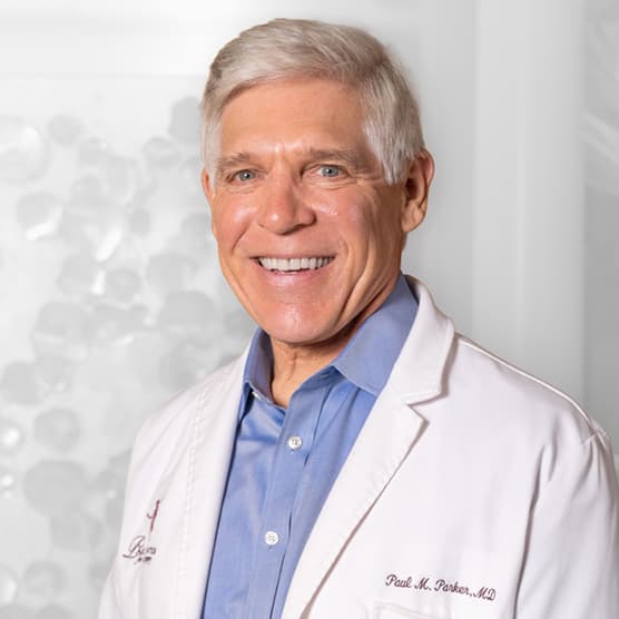 Dr. Paul M. Parker, Paramus NJ board-certified plastic surgeon in white lab coat
